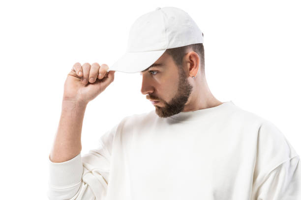 istock Handsome man wearing blank white cap on white background 1324853133