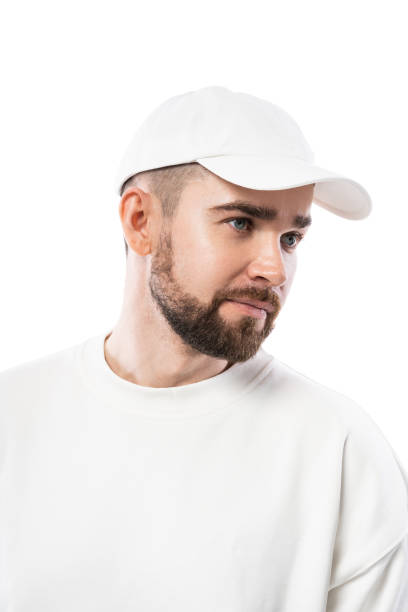 istock Handsome man wearing blank white cap on white background 1324853182