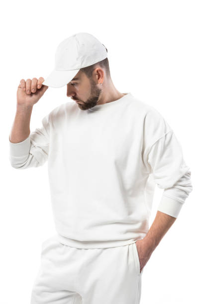 istock Handsome man wearing blank white cap on white background 1324853206