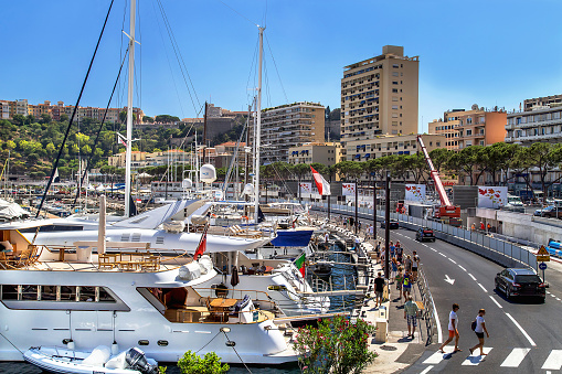 Monaco, France - July 24, 2017: Scenic view  of city streets with building  and marina with expensive yacht in luxury Monaco (Monte Carlo).