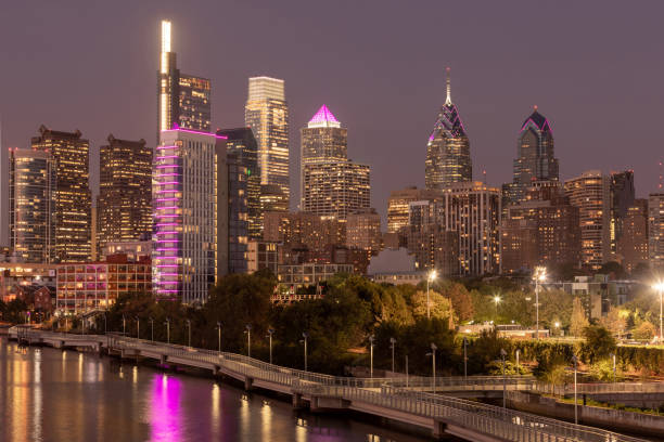 istock Philadelphia Downtown skyline at Night with the Schuylkill river. Beautiful Sunset Light. Schuylkill River Trail in Background. City skyline glows under the beautiful sunset light. Cityscape. PA, USA. 1324854772