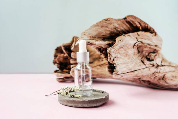 istock Front view of face serum bottle. Concrete. 1324854987