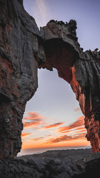 istock Vertical of Morning Sun Rising at Wolfberg Arch 1324859859