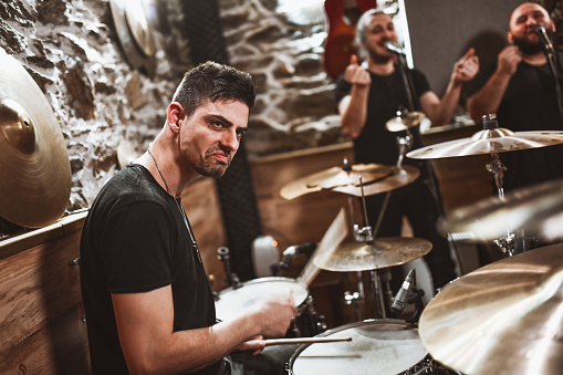 Drummer Leading His Band In Studio With Tight Groove