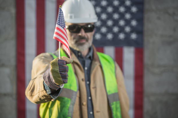 istock A serious worker man and american flag 1324860283