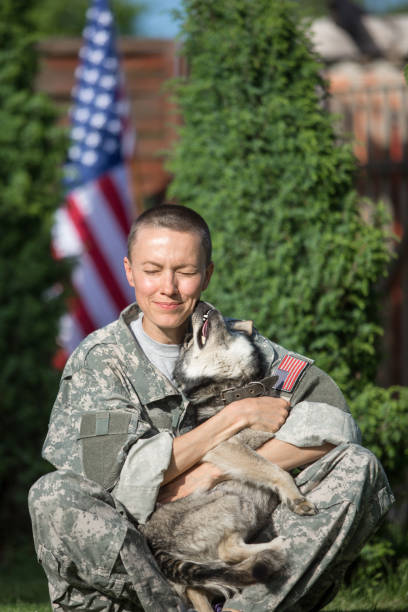 istock Soldier with military dog outdoors on a sunny day 1324860407