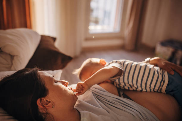 istock Mother breastfeeding her son 1324863755