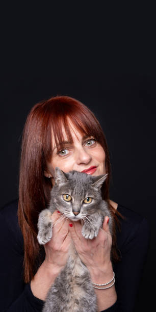 istock Happy Woman with her Cat 1324864171