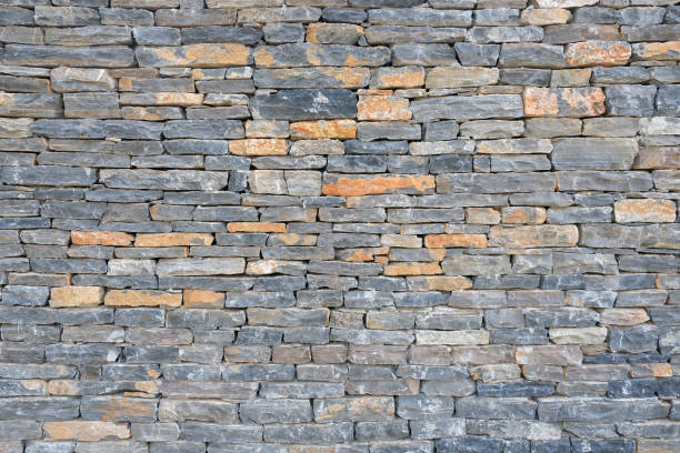 istock Gray modern pattern of stone wall decorative surfaces. 1324864974