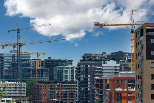 Close-up view of buildings and cranes