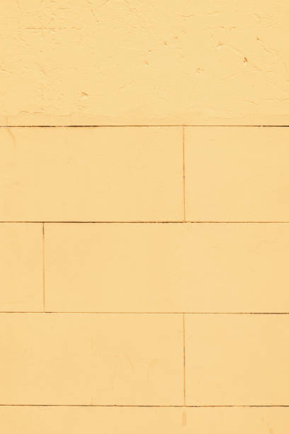 istock Part of a yellow concrete wall 1324866841