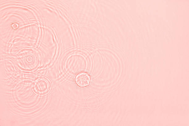 istock pink transparent clear water surface texture summer background 1324868138