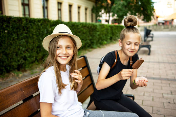 istock Caucasian twin sisters having fun outdoors 1324871241