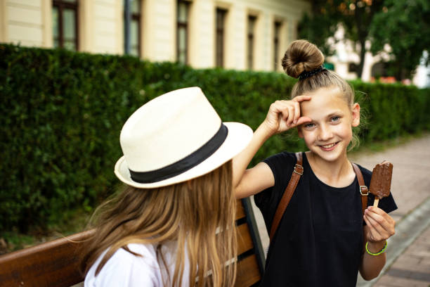 istock Caucasian twin sisters having fun outdoors 1324871261