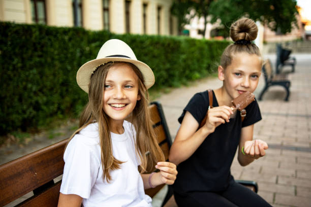 istock Caucasian twin sisters having fun outdoors 1324871272