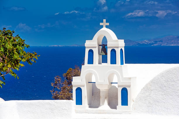 Belltower of an old chapel/church, Santorini, Greece Classical view of a belltower in the picturesque old town of Oia village on Santorini island, Greece. chapel photos stock pictures, royalty-free photos & images