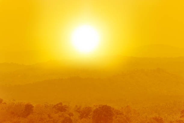 Yellow sunset over the mountains. Mist
