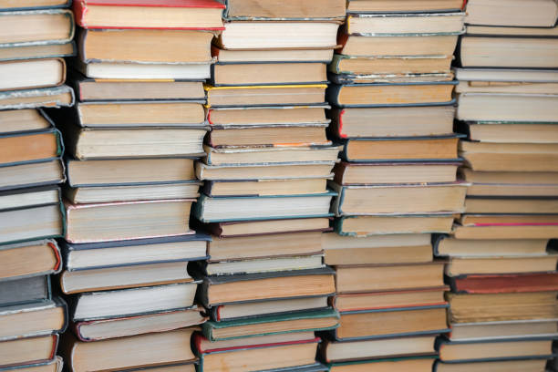 istock Background. Many old books and textbooks are in the library 1324872385