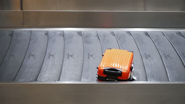 Suitcases on  baggage claim