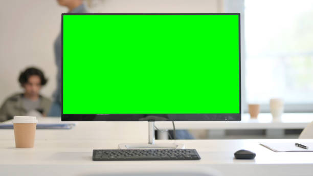 istock Close up of Desktop with Green Chroma Key Screen 1324875772