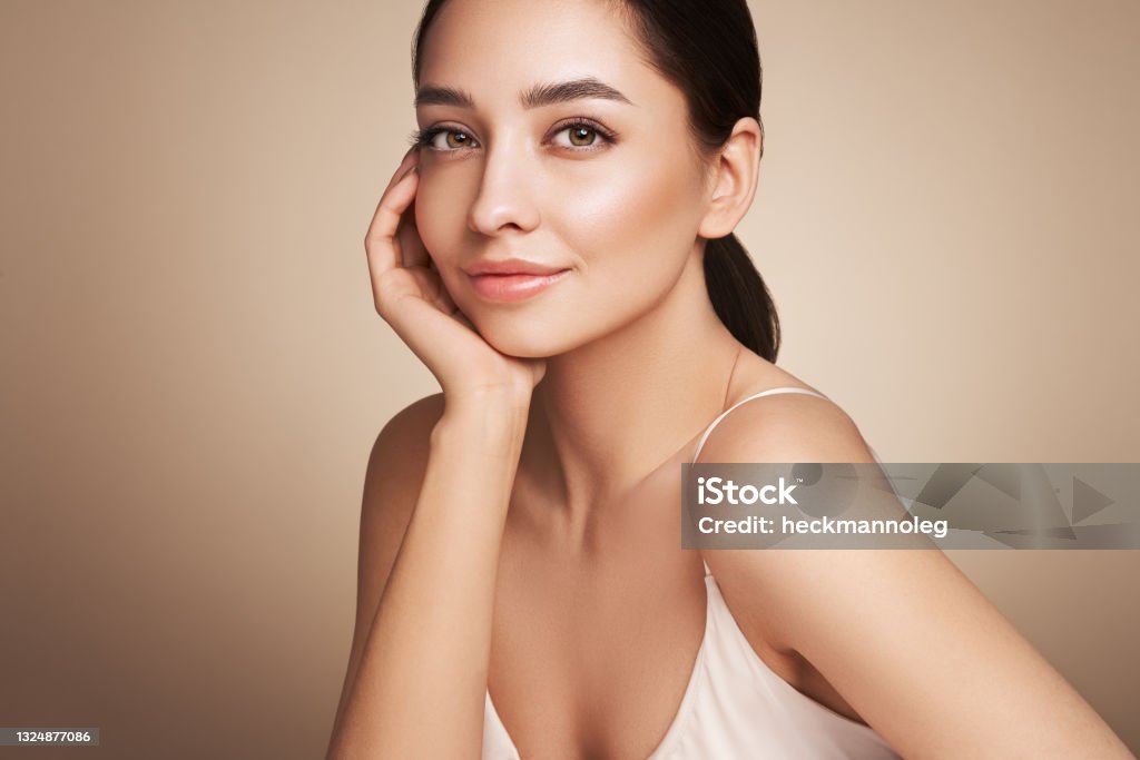 Portrait beautiful young woman with clean fresh skin Portrait beautiful young woman with clean fresh skin. Model with healthy skin, close up portrait. Cosmetology, beauty and spa Women Stock Photo