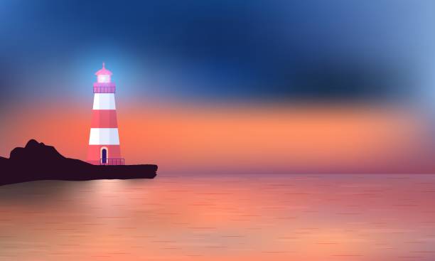 istock Beautiful sunset on ocean beach with the luminous Lighthouse standing on the embankment. 1324877314