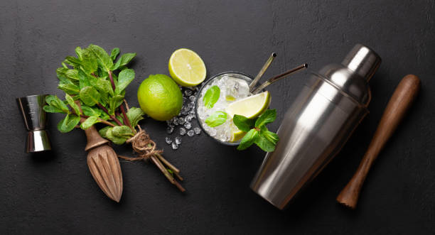 istock Mojito cocktail making. Ingredients and drink utensils 1324879241