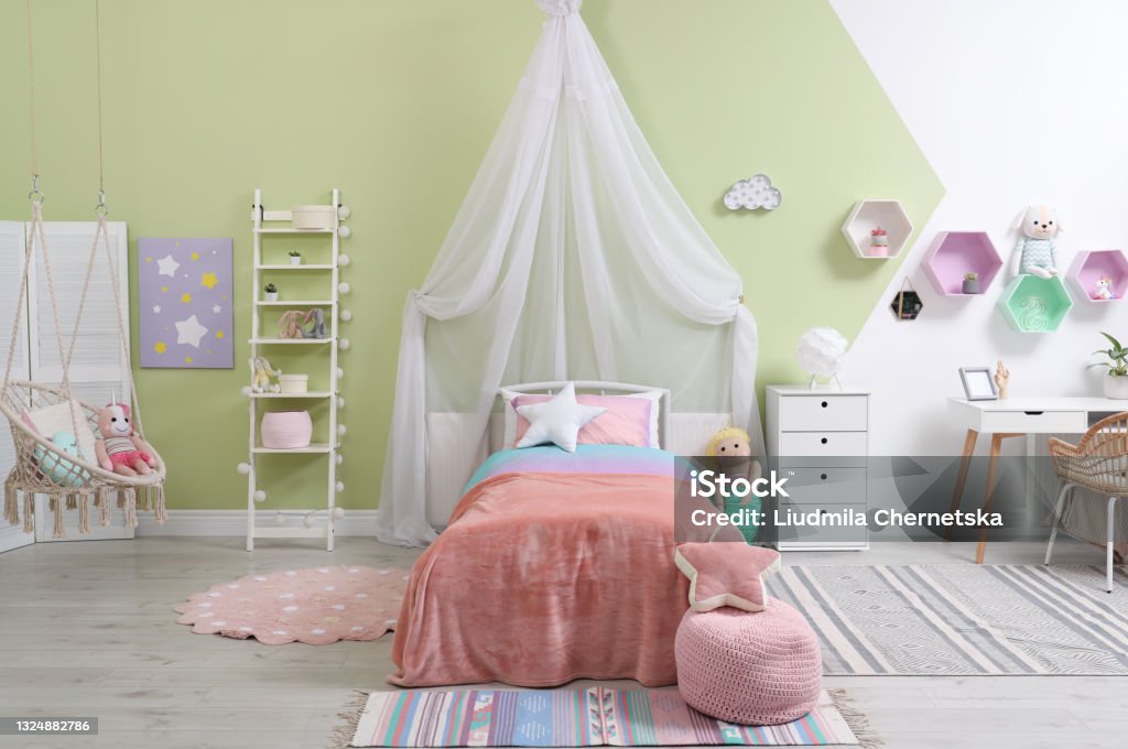 Cute child's room interior with toys and modern furniture Childhood Stock Photo