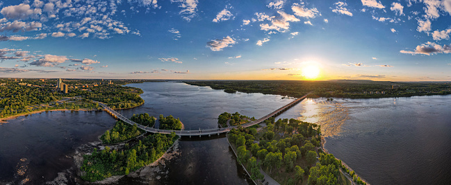 Aerial drone photograph of Champlain Bridge, Bates Island, Ottawa river in sunset