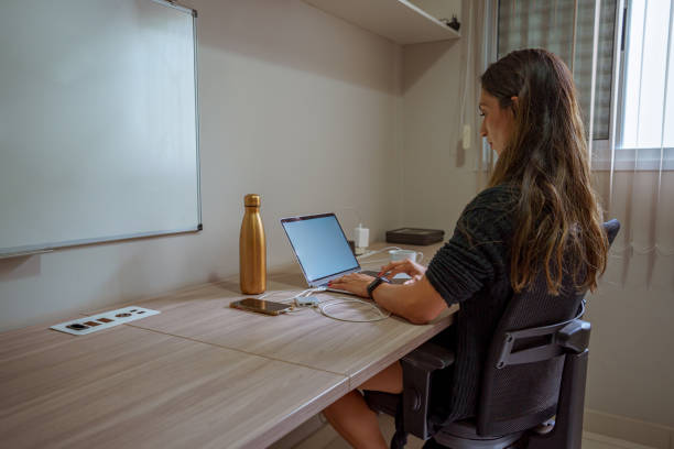 istock woman studying at home 1324884094