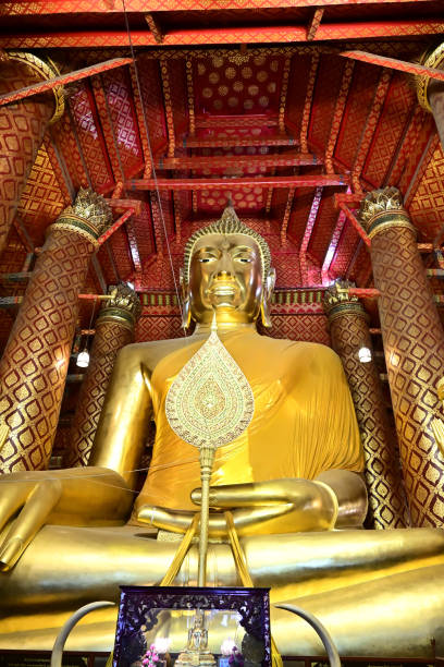 istock Golden buddha statue at Wat Phananchoeng, Thailand 1324884578