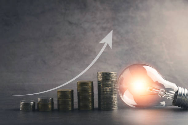 istock A light bulb with money coin stack growing for business. financial and accounting concept. 1324885793