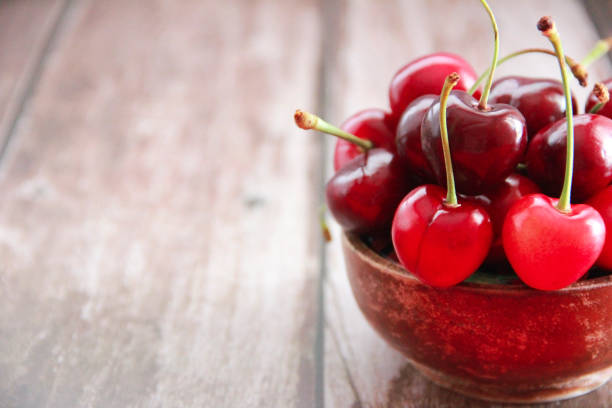 istock natural red cherry fruit with green peduncle 1324885822
