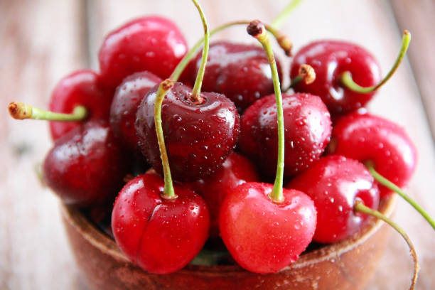 istock natural red cherry fruit with green peduncle 1324885837