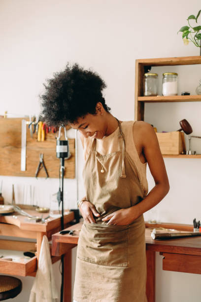 istock Cheerful jewelry artist standing at workshop 1324886692