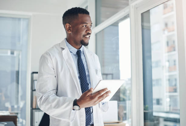 istock Shot of a young doctor using a digital tablet in an office 1324887399
