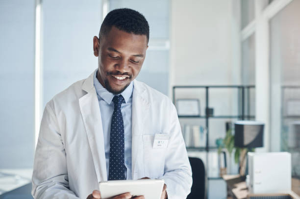 istock Shot of a young doctor using a digital tablet in an office 1324887401