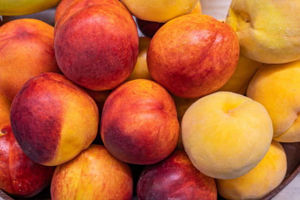 istock Fresh ripe peaches on the store counter 1324889504