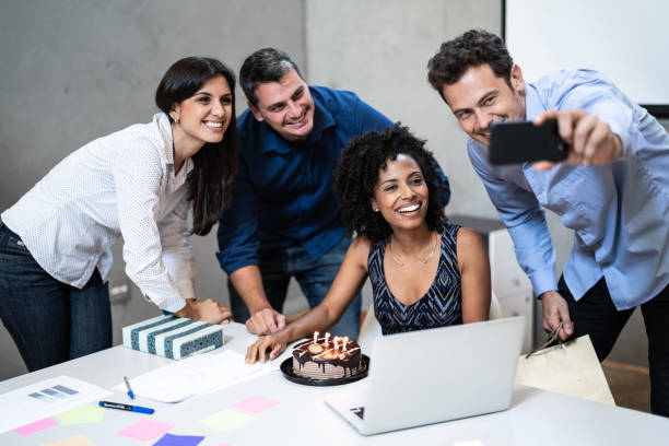 istock Business colleagues taking a selfie during birthday party at work 1324889937