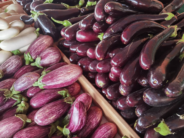 istock eggplants many eggplant  black white purple on a kiosk in summer 1324890652