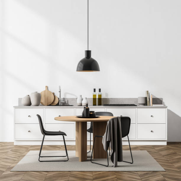 istock Light dining room interior with minimalist furniture and kitchen set 1324890863
