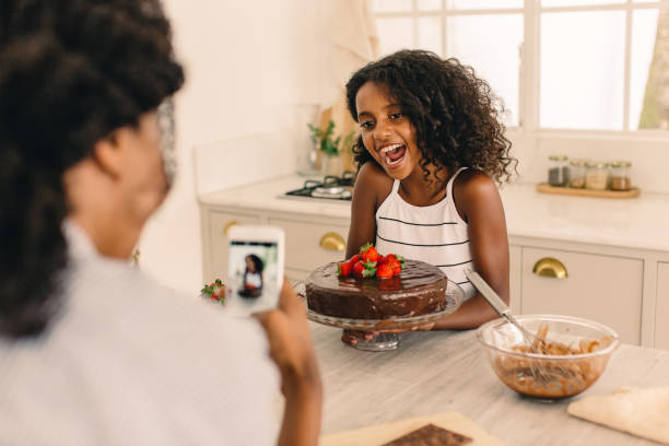 Girl learning to make cake with her mother