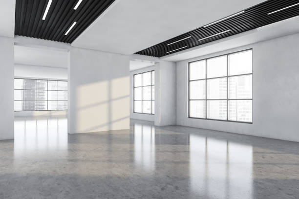 istock White and wooden large empty office room with windows 1324892046
