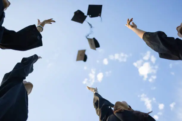 A group of Asian graduates