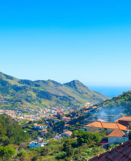 istock Maderia village ocean mountains perspective 1324893532
