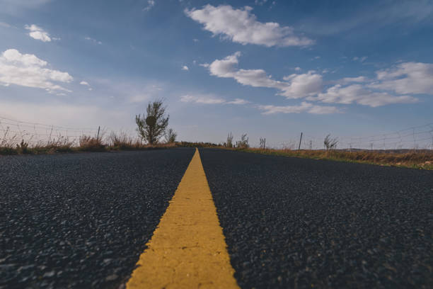 istock The Road In Grassland Under Cloudy Sky At Sunset 1324894568