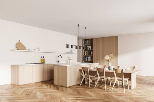 istock Modern design kitchen living room interior. dining table with six chairs, bookshelfs with cooking books, wooden floor. 3d rendering. 1324895074