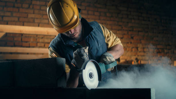 istock Adult man cutting brick wall 1324899611