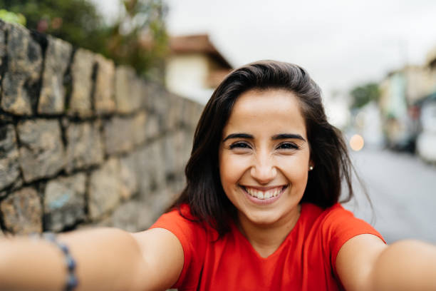 istock Happy woman hugging the camera 1324903233