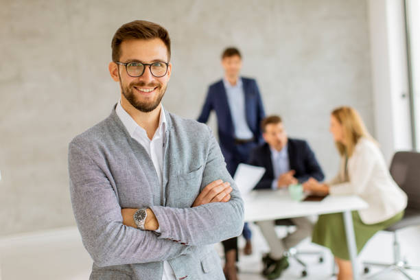 istock Handsome young business man standing confident in the office 1324903446